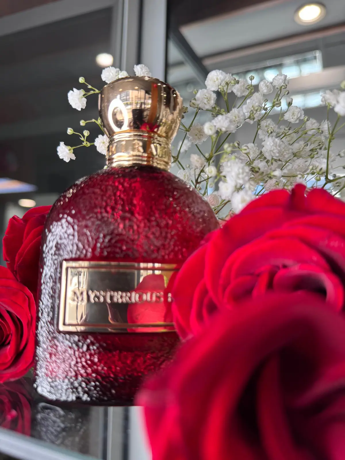 Red statement fragrance bottle from the Metromen in-studio collection